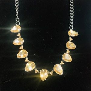 Short silver chained w light amber cut glass